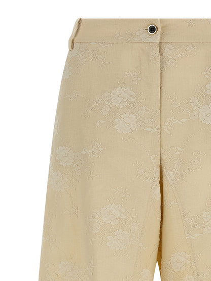 Trousers by PINKO for women in linen beige features an on trend silhouette, showcasing a sophisticated flared & wide with a long and mid rise for an on trend finish.