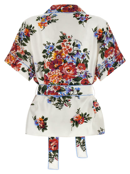 Blouse by Dolce & Gabbana for women in silk twill pearl, white, floral & print features an architectural silhouette with a refined and elegant lapel neckline for a architectural look.