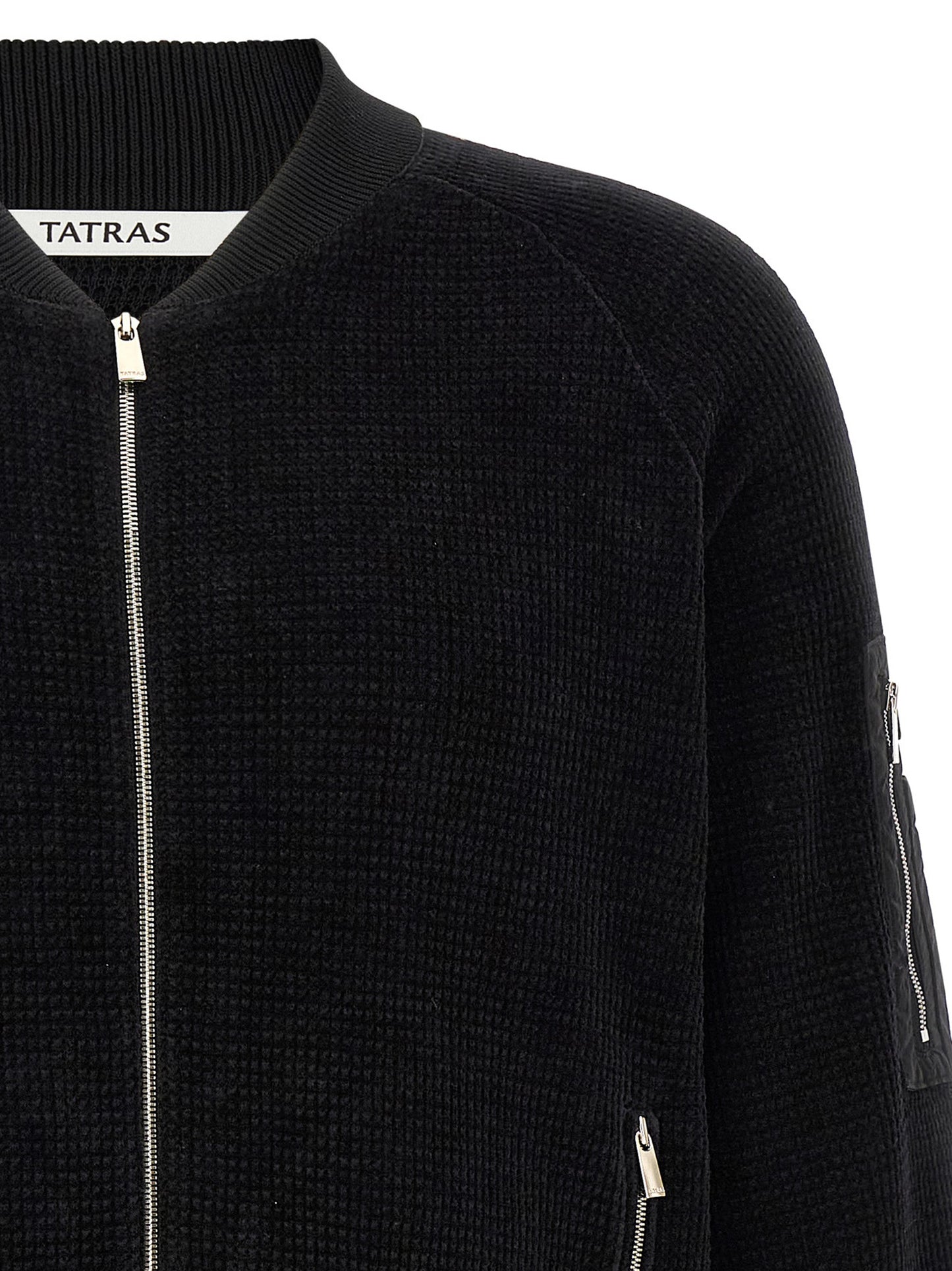 This Bomber Jacket by Tatras for men in nylon cotton polyester black exhibits a edgy silhouette, meticulously detailed with functional pockets and a edgy high-neck neckline for a edgy finish.