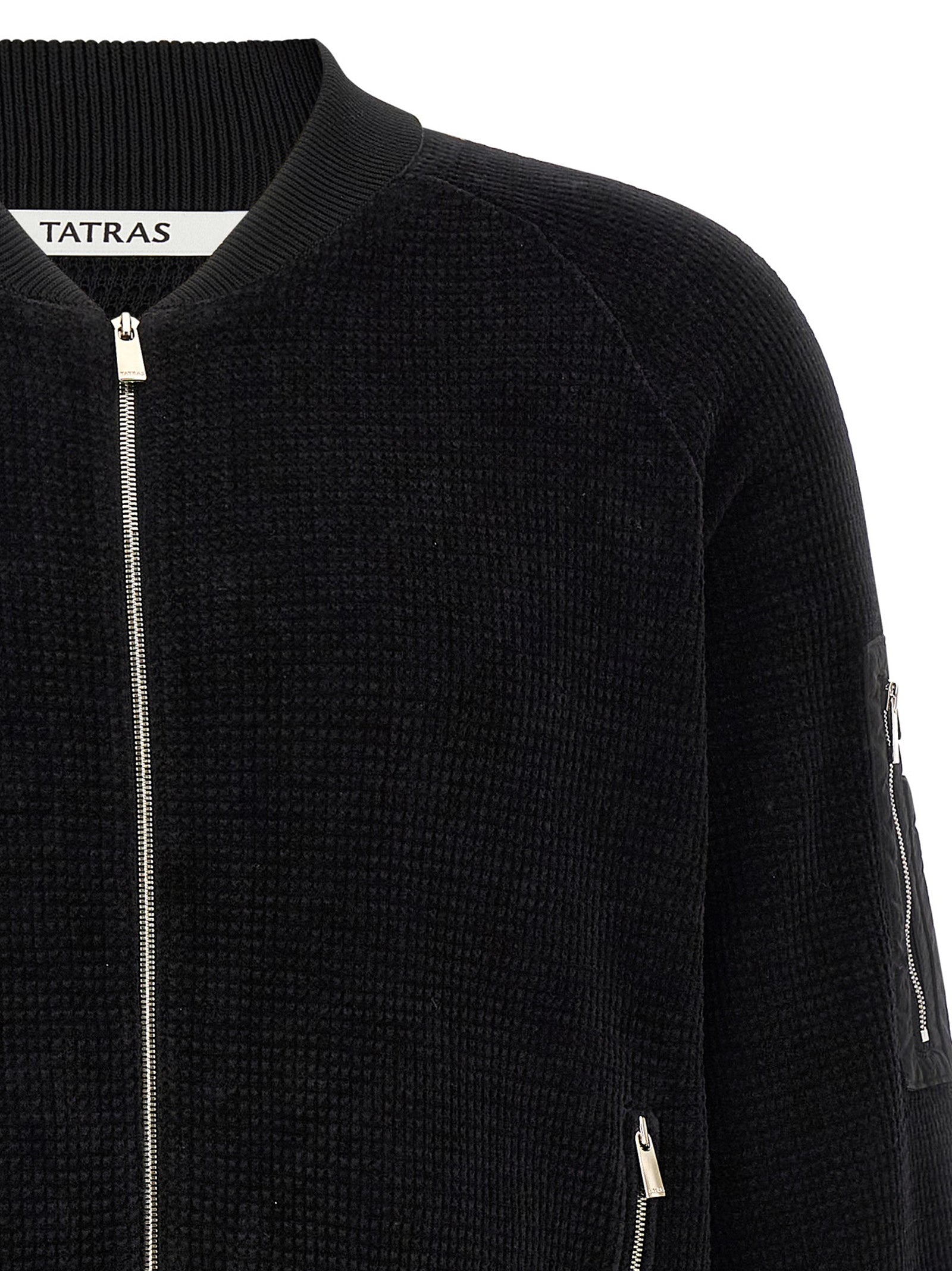 This Bomber Jacket by Tatras for men in nylon cotton polyester black exhibits a edgy silhouette, meticulously detailed with functional pockets and a edgy high-neck neckline for a edgy finish.
