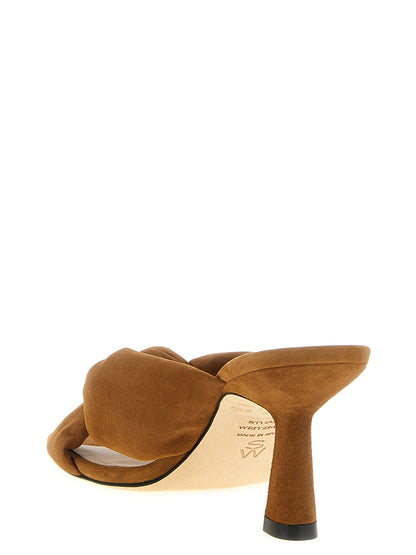 Stiletto Slider Sandals by Stuart Weitzman for women in polyethylene polyurethane suede leather and brown presents a captivating silhouette, showcasing the signature style of the Women's Polyethylene Polyurethane Suede Leather Stiletto Slider Sandals with a captivating stiletto and captivating .