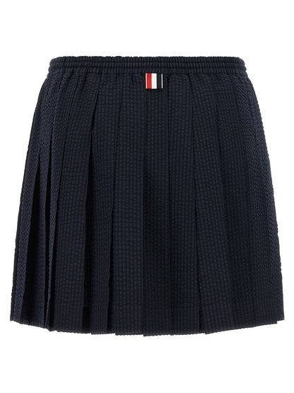 Skirt by Thom Browne for women in wool blue & striped features a sublime silhouette, showcasing the sublime design of the Women's Pleated Flared Wool Mini Long Skirt in a sophisticated mini long.