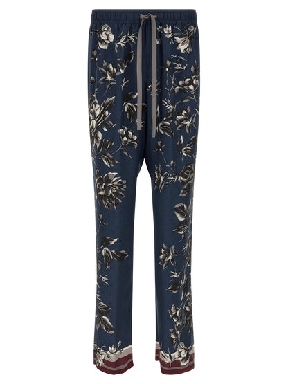 Trousers by Dolce & Gabbana for men in silk twill blue & print features a tailored silhouette with a tailored straight-leg & wide, defined by its long and a sophisticated .