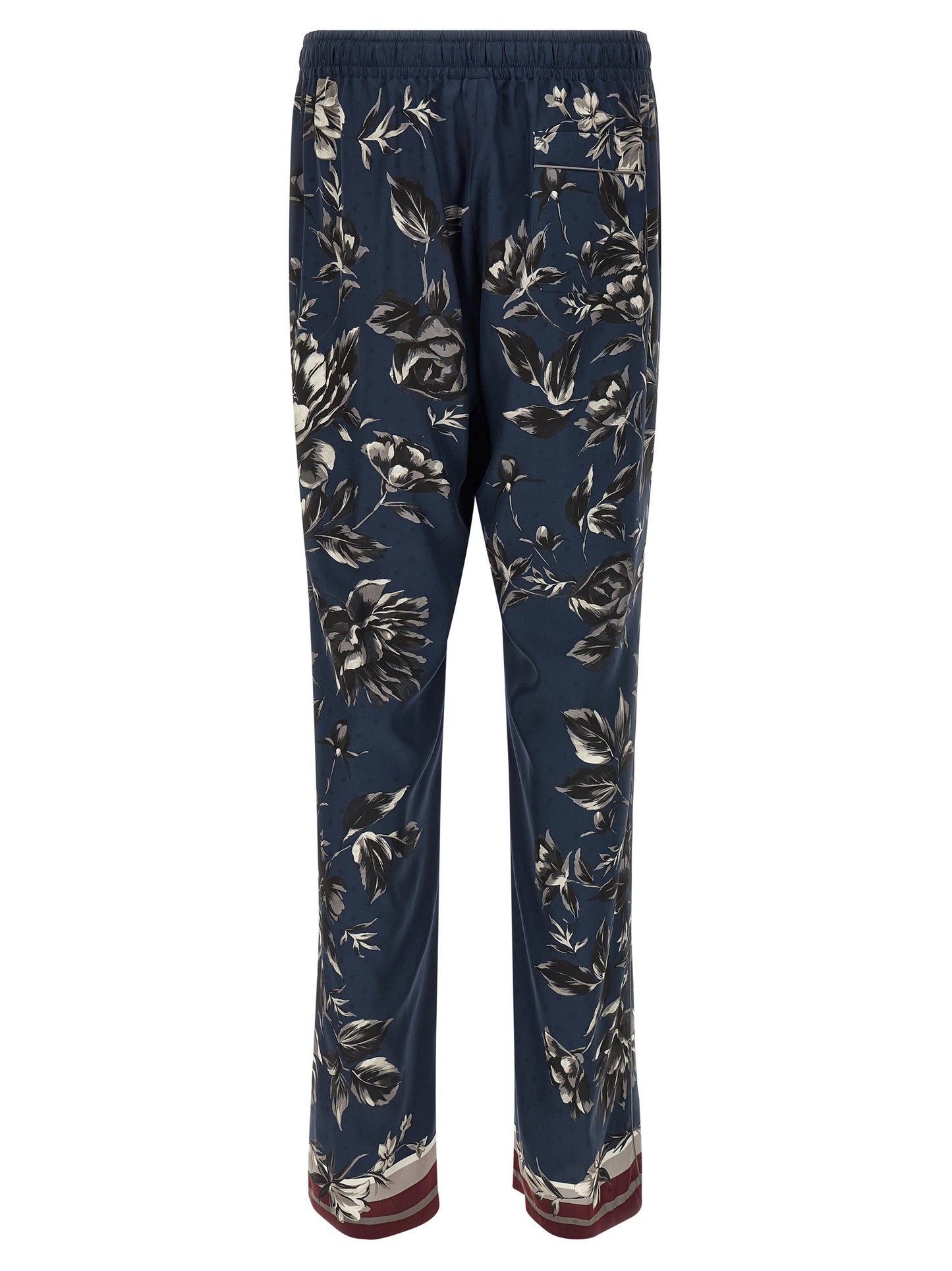 Trousers by Dolce & Gabbana for men in silk twill blue & print presents a perennial silhouette, meticulously tailored with a straight-leg & wide cut, long finish, and an elegant .