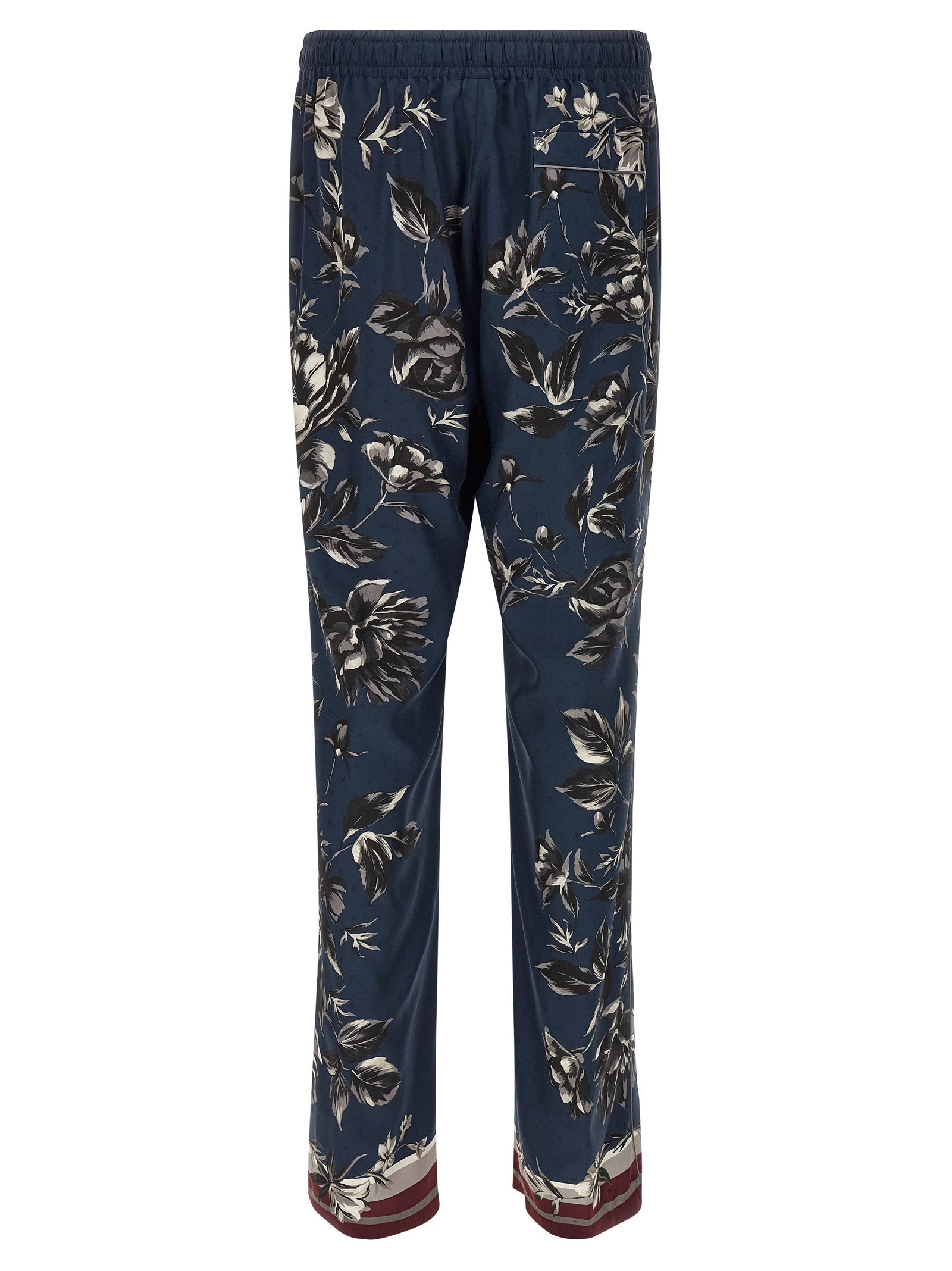 Trousers by Dolce & Gabbana for men in silk twill blue & print presents a perennial silhouette, meticulously tailored with a straight-leg & wide cut, long finish, and an elegant .