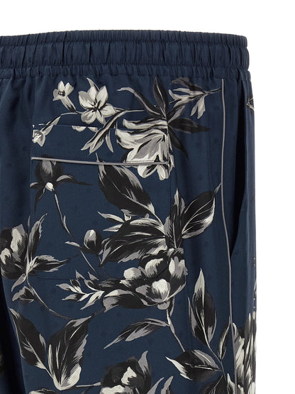 Trousers by Dolce & Gabbana for men in silk twill blue & print presents a smart silhouette, meticulously detailed with a smart straight-leg & wide, a smart long, and a smart .