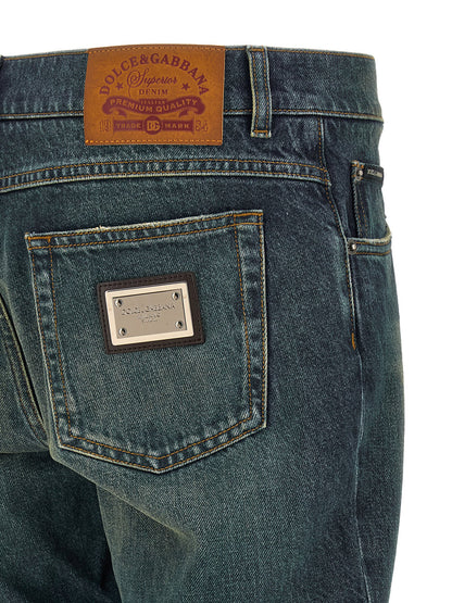 Jeans by Dolce & Gabbana for men in cotton denim blue presents a tailored silhouette, showcasing a tailored straight-leg and long cut with a refined low rise for a truly tailored aesthetic.