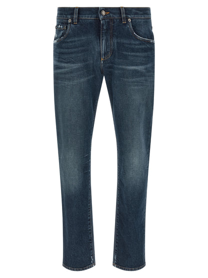 Jeans by Dolce & Gabbana for men in stretch denim cotton blue presents a tailored silhouette, showcasing a tailored and long cut with a refined low rise for a truly tailored aesthetic.