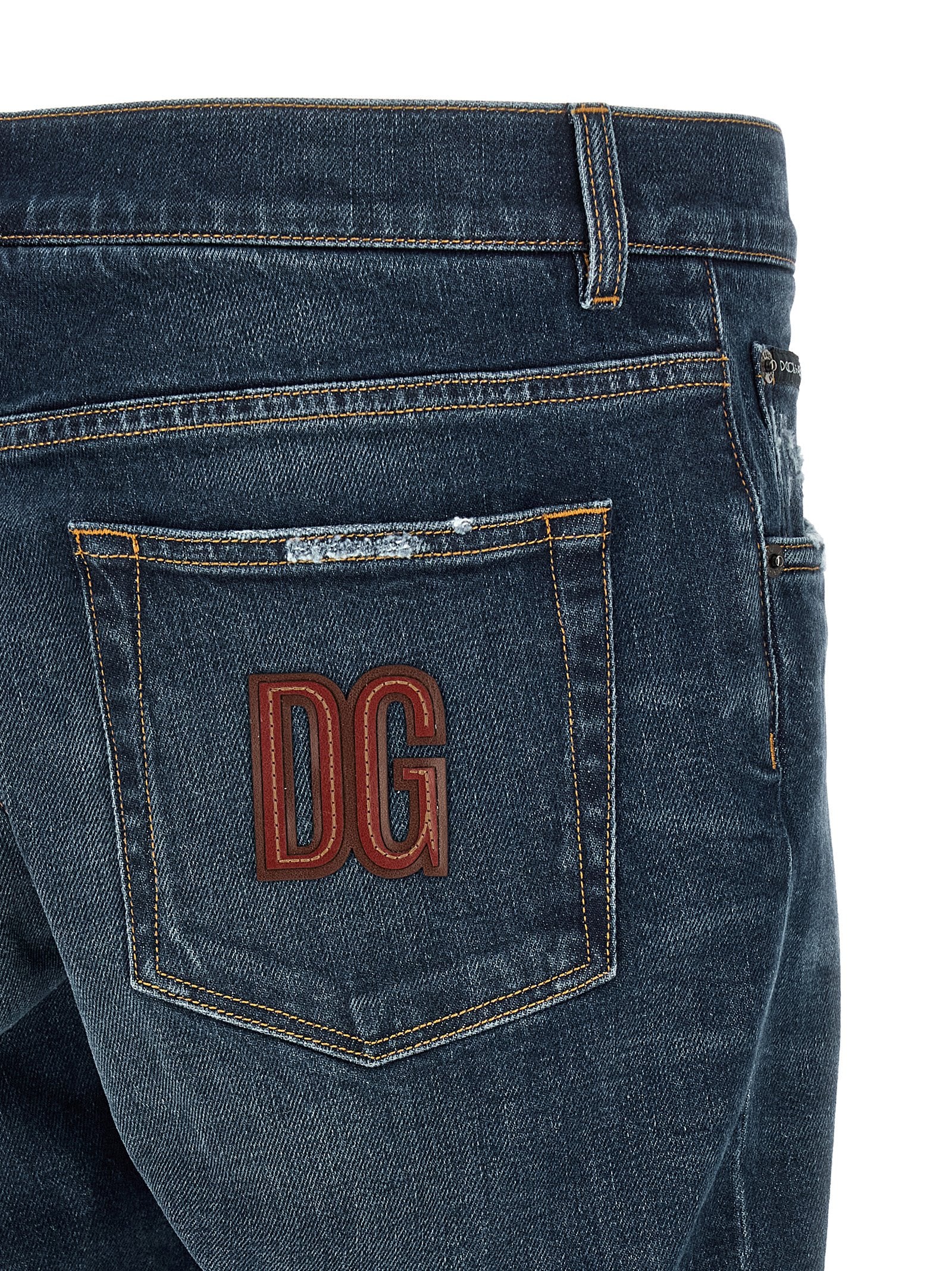 Jeans by Dolce & Gabbana for men in stretch denim cotton blue presents a tailored silhouette, showcasing a tailored and long cut with a refined low rise for a truly tailored aesthetic.