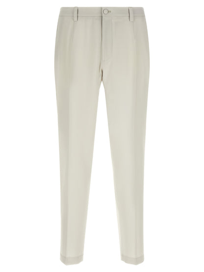Trousers by Dolce & Gabbana for men in virgin wool beige features an on trend silhouette, showcasing a sophisticated straight-leg with a long and for an on trend finish.
