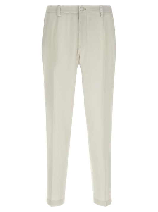 Trousers by Dolce & Gabbana for men in virgin wool beige features an on trend silhouette, showcasing a sophisticated straight-leg with a long and for an on trend finish.