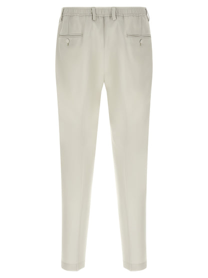 Trousers by Dolce & Gabbana for men in virgin wool beige presents a smart silhouette, meticulously detailed with a smart straight-leg, a smart long, and a smart .
