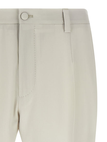 Trousers by Dolce & Gabbana for men in virgin wool beige features a artisanal silhouette, showcasing a sophisticated straight-leg with a long and for a artisanal finish.