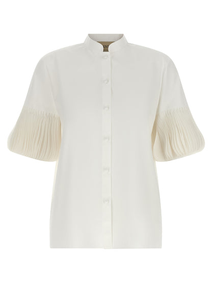 Blouse by Valentino Garavani for women in cotton white & patterned showcases a sharp silhouette, elegantly detailed with a sharp mandarin neckline and sharp short-sleeve.