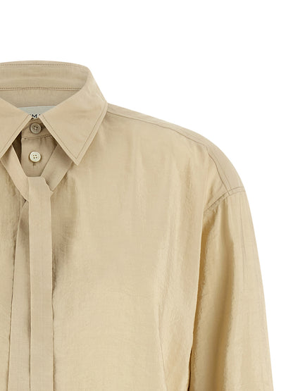 Blouse by Lemaire for women in polyamide & silk beige showcases a sharp silhouette, elegantly detailed with a sharp shirt-collar neckline and sharp .