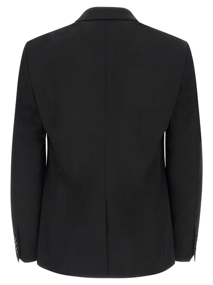 This Blazer by Dolce & Gabbana for men in silk & virgin wool black presents a tailored silhouette, meticulously tailored with a tailored split neckline and distinctive for a tailored finish.
