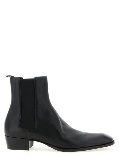Ankle Chelsea Boots by Saint Laurent for men in bos taurus calfskin leather black showcases a impeccable silhouette as Men's Bos Taurus Calfskin Leather Ankle Chelsea Boots, artfully defined by a impeccable and a impeccable square toe style.