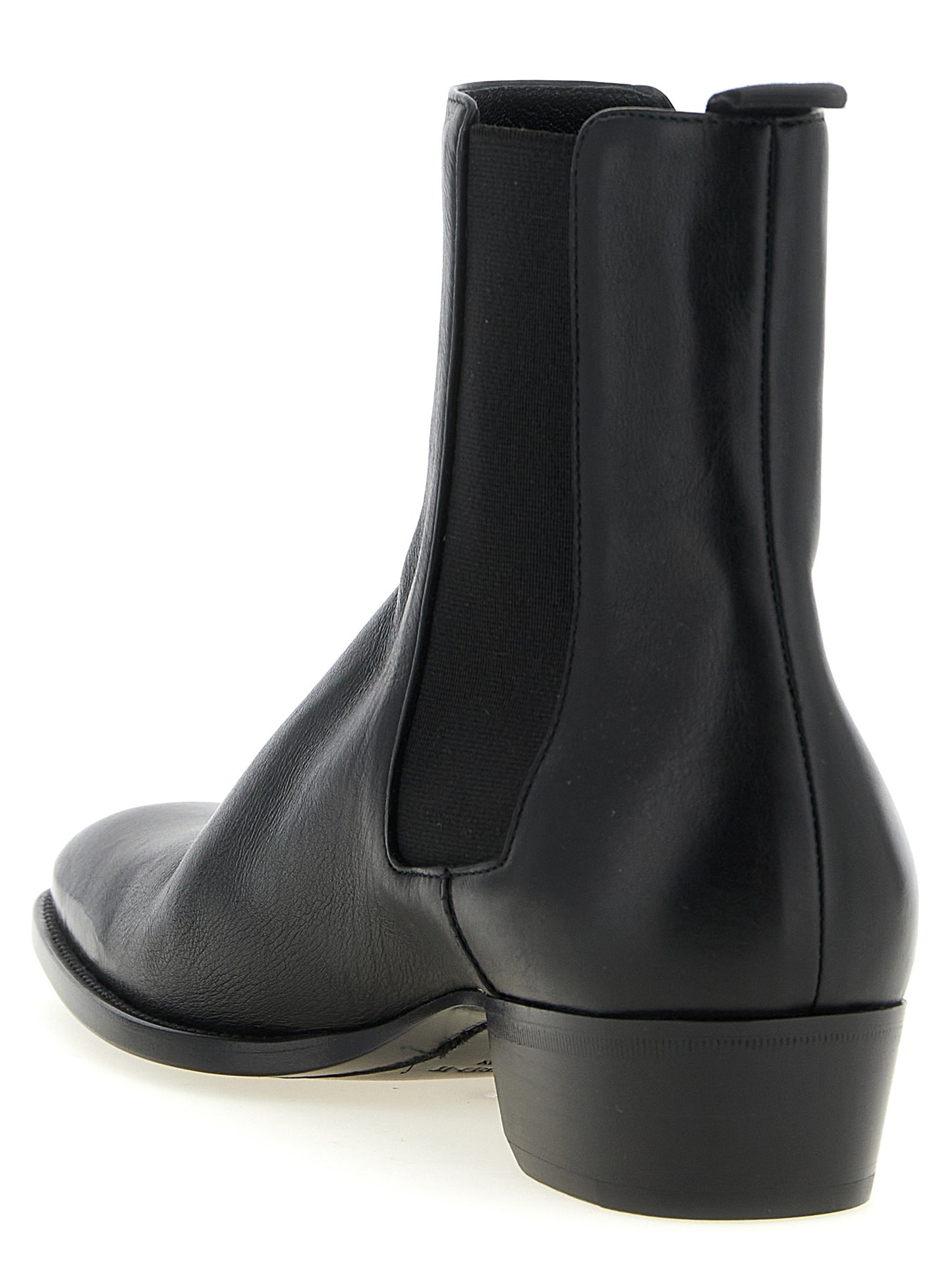Ankle Chelsea Boots by Saint Laurent for men in bos taurus calfskin leather black features an avant-garde Men's Bos Taurus Calfskin Leather Ankle Chelsea Boots silhouette, defined by a sophisticated and a avant-garde square toe style.