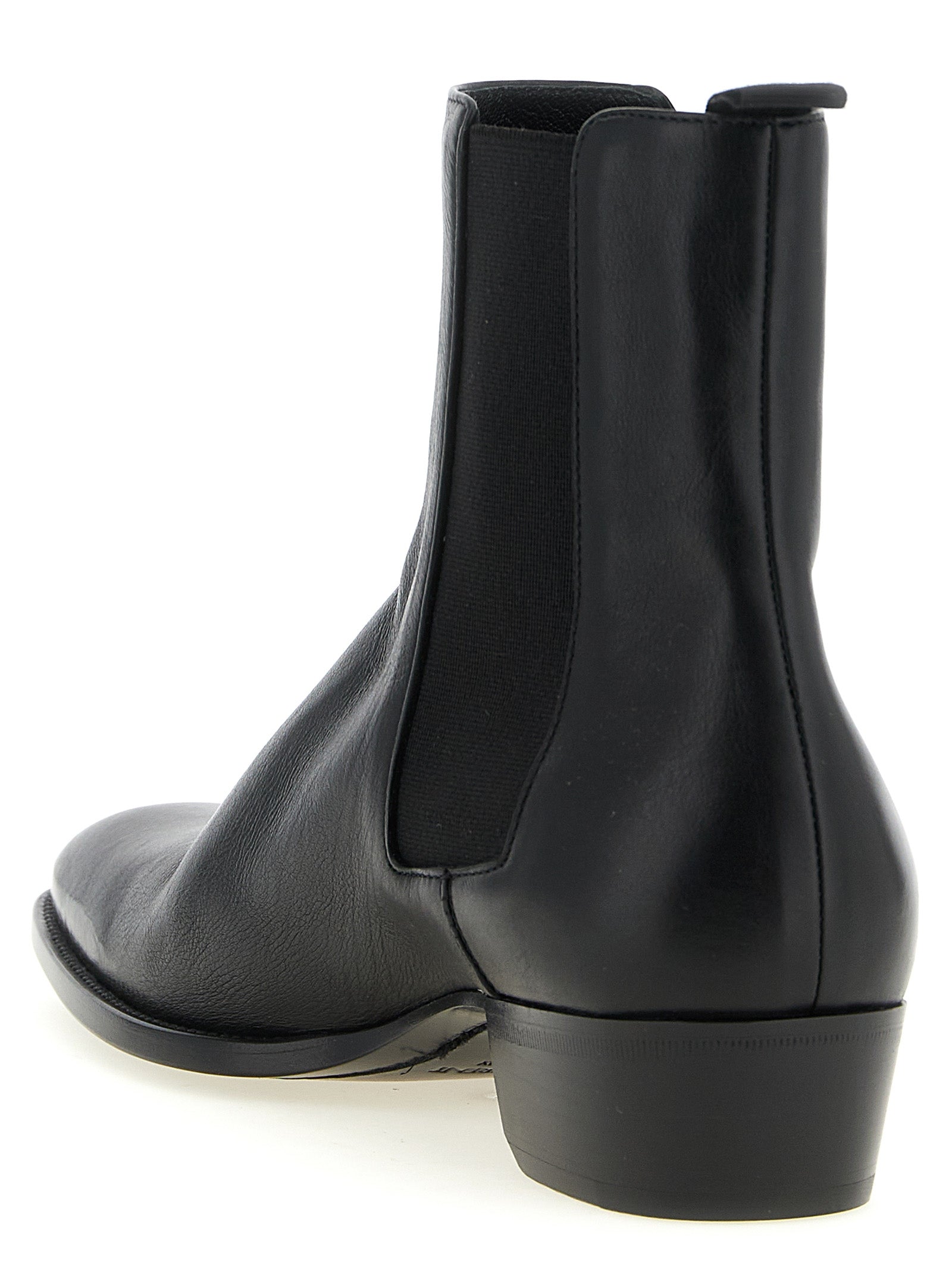 Ankle Chelsea Boots by Saint Laurent for men in bos taurus calfskin leather black features an avant-garde Men's Bos Taurus Calfskin Leather Ankle Chelsea Boots silhouette, defined by a sophisticated and a avant-garde square toe style.