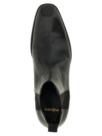 Ankle Chelsea Boots by Saint Laurent for men in bos taurus calfskin leather black features an enchanting design from the Men's Bos Taurus Calfskin Leather Ankle Chelsea Boots collection, highlighting a enchanting and square toe style for a refined look.