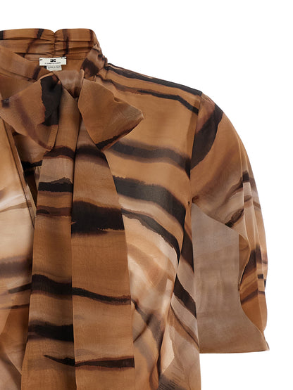 Dress by Elisabetta Franchi for women in raffia polyester chiffon animal, brown & print features a dramatic silhouette, showcasing an elegant v-neck neckline and that flows into a dramatic short mini.
