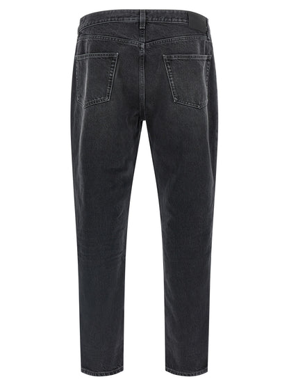 Jeans by Saint Laurent for men in cotton denim black presents a refined pantology silhouette, artfully defined by a refined pantology straight-leg, long, and a sophisticated .