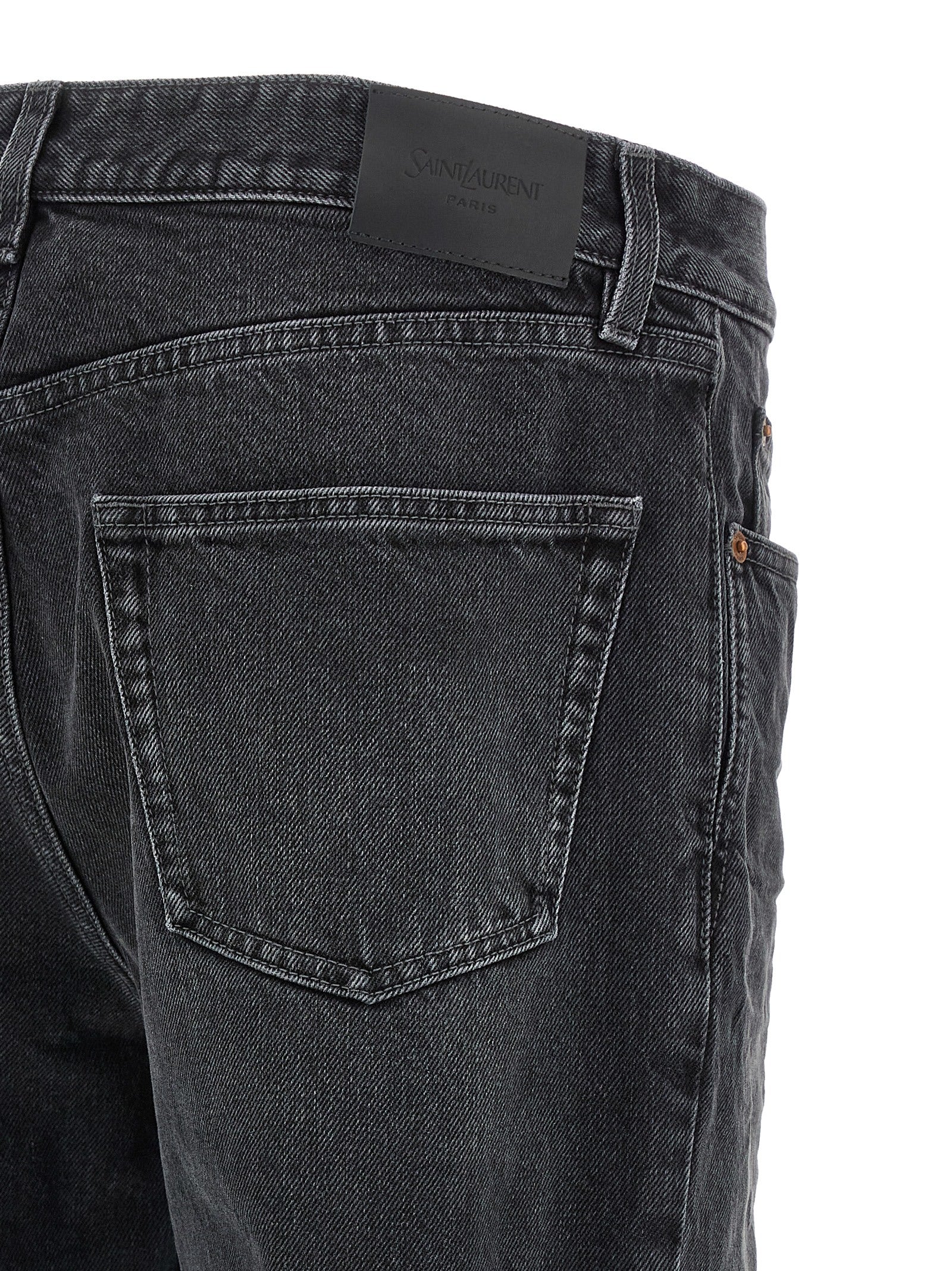 Jeans by Saint Laurent for men in cotton denim black presents a tailored silhouette, showcasing a tailored straight-leg and long cut with a refined for a truly tailored aesthetic.
