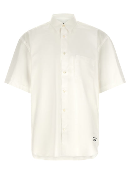 Shirt by Comme Des Garçons for men in cotton pearl & white features an architectural silhouette with a refined short-sleeve and elegant for a architectural look.