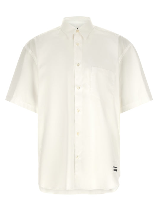 Shirt by Comme Des Garçons for men in cotton pearl & white features an architectural silhouette with a refined short-sleeve and elegant for a architectural look.