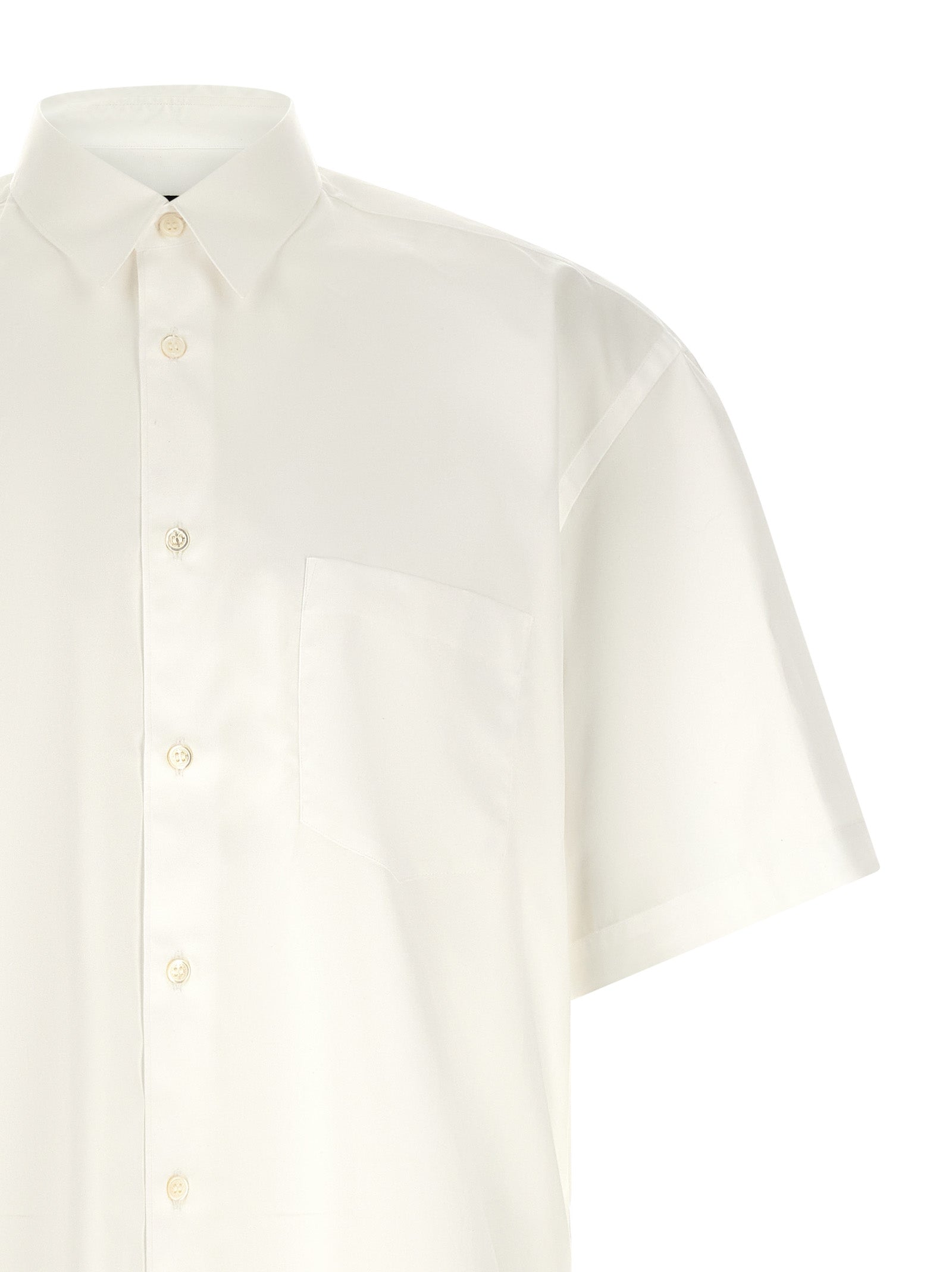 Shirt by Comme Des Garçons for men in cotton pearl & white showcases a sleek silhouette, elegantly detailed with a sleek and for a sleek finish.