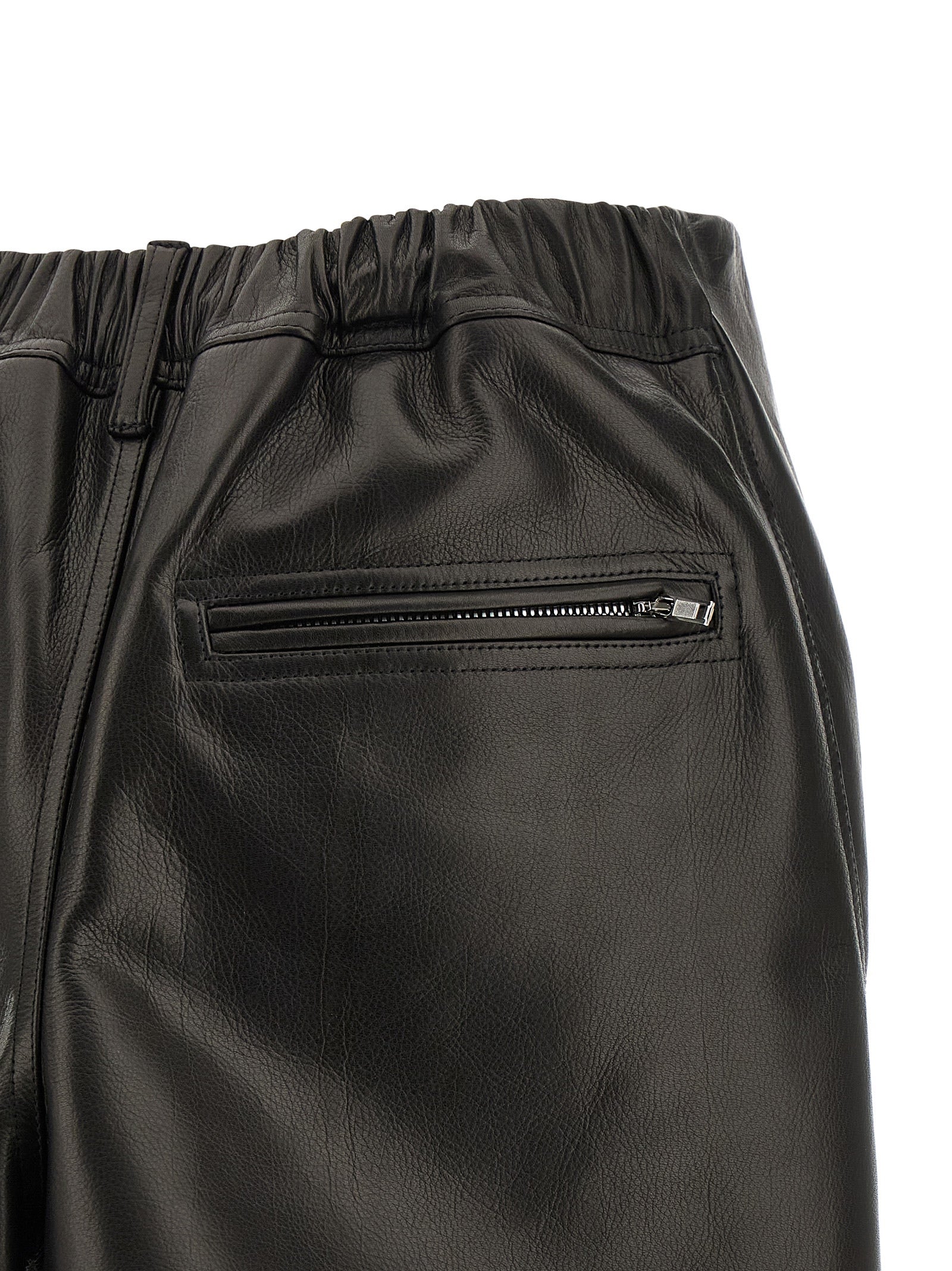 Skirt by Rick Owens for women in calfskin leather black showcases a dramatic silhouette, artfully capturing the essence of the Ribbon Women's Asymmetrical Calfskin Leather Mini Long Skirt in a dramatic mini long cut for a refined look.