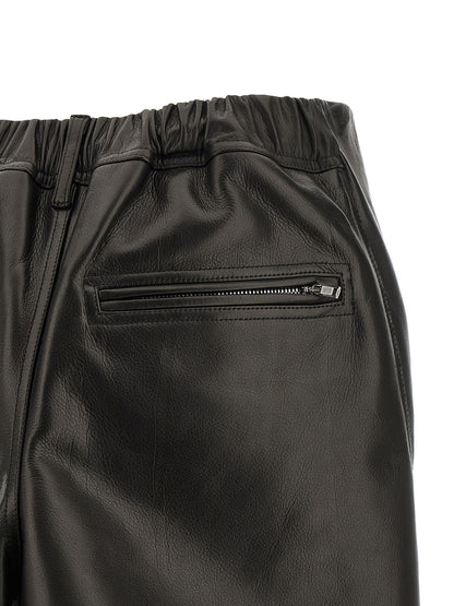 Skirt by Rick Owens for women in calfskin leather black showcases a dramatic silhouette, artfully capturing the essence of the Ribbon Women's Asymmetrical Calfskin Leather Mini Long Skirt in a dramatic mini long cut for a refined look.