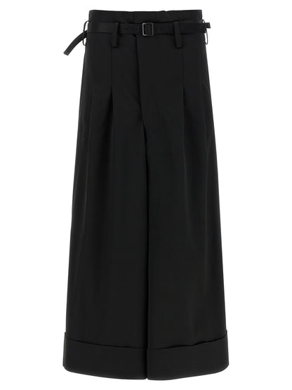 Trousers by Junya Watanabe for women in satin acetate wool black features a tailored silhouette with a tailored flared, wide & cropped, defined by its cropped and a sophisticated high rise.