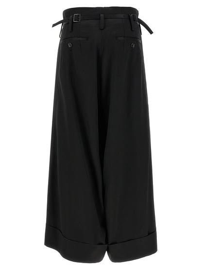 Trousers by Junya Watanabe for women in satin acetate wool black presents a smart silhouette, meticulously detailed with a smart flared, wide & cropped, a smart cropped, and a smart high rise.