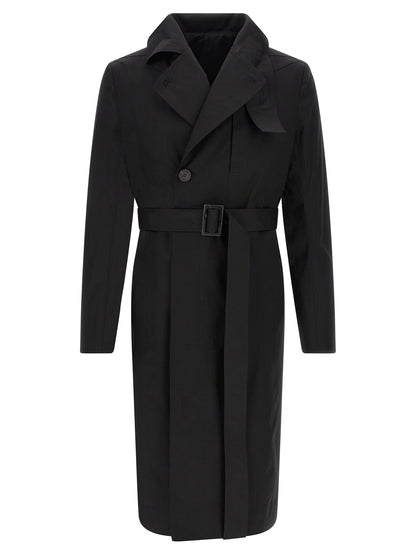 Trench Coat by Rick Owens for men in stretch cotton black presents a utilitarian silhouette, showcasing a utilitarian and sophisticated insulated for a truly utilitarian look.