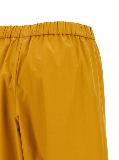 Casual Pants by Fabiana Filippi for women in cotton bicolour & yellow presents a refined pantology silhouette, artfully defined by a refined pantology wide, long, and a sophisticated .