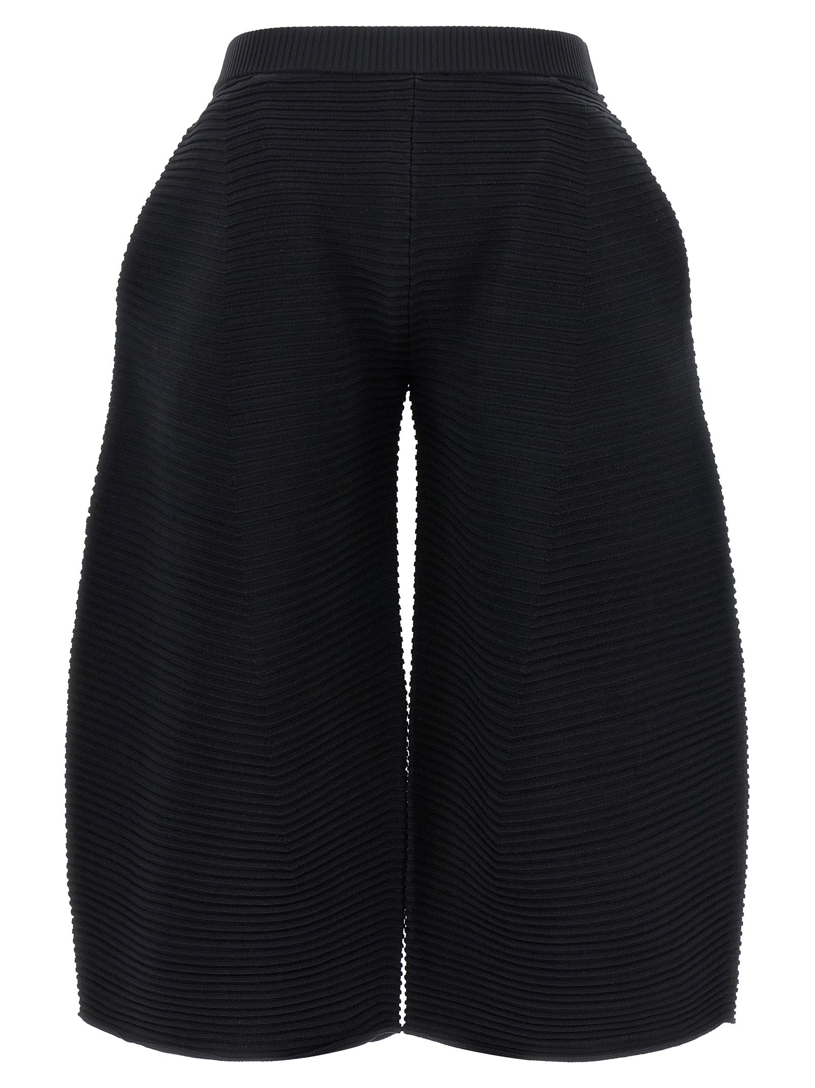 Trousers by Issey Miyake for women in polyester & nylon black features a sculptural silhouette, showcasing a sculptural wide & cropped and cropped with a sophisticated for a sculptural finish.
