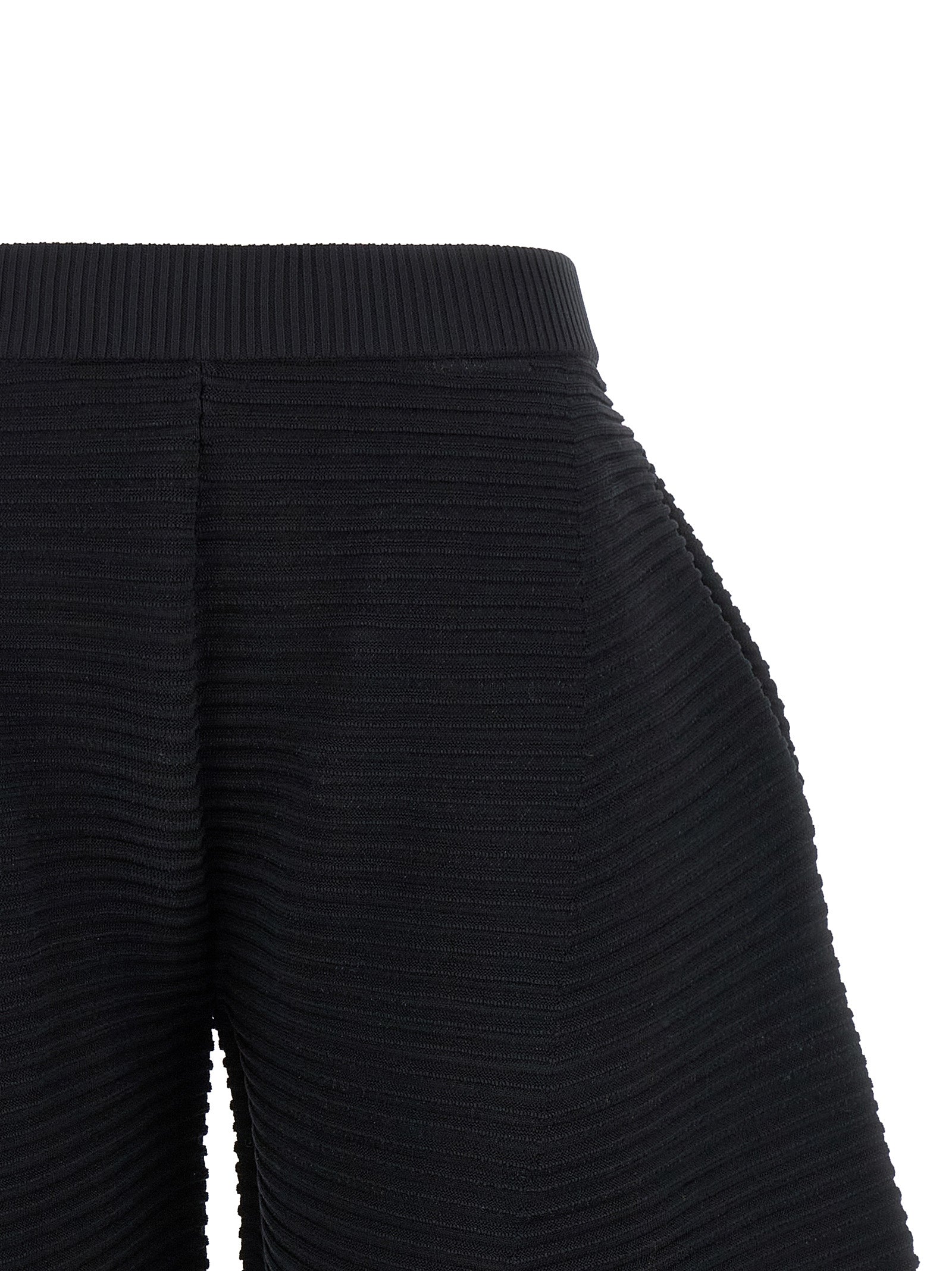 Trousers by Issey Miyake for women in polyester & nylon black features an on trend silhouette, showcasing a sophisticated wide & cropped with a cropped and for an on trend finish.