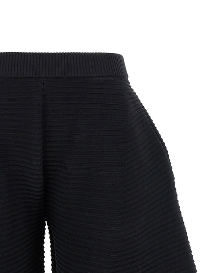 Trousers by Issey Miyake for women in polyester & nylon black features an on trend silhouette, showcasing a sophisticated wide & cropped with a cropped and for an on trend finish.