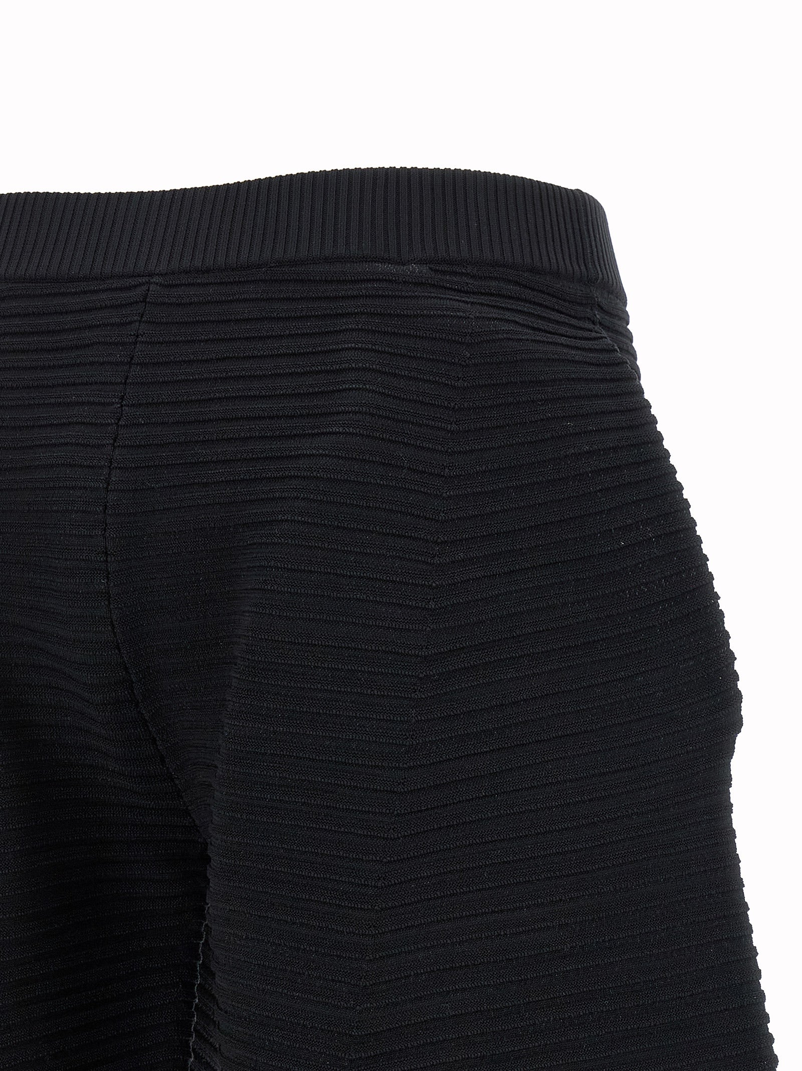 Trousers by Issey Miyake for women in polyester & nylon black features a tailored silhouette with a tailored wide & cropped, defined by its cropped and a sophisticated .