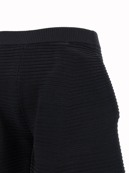 Trousers by Issey Miyake for women in polyester & nylon black features a tailored silhouette with a tailored wide & cropped, defined by its cropped and a sophisticated .