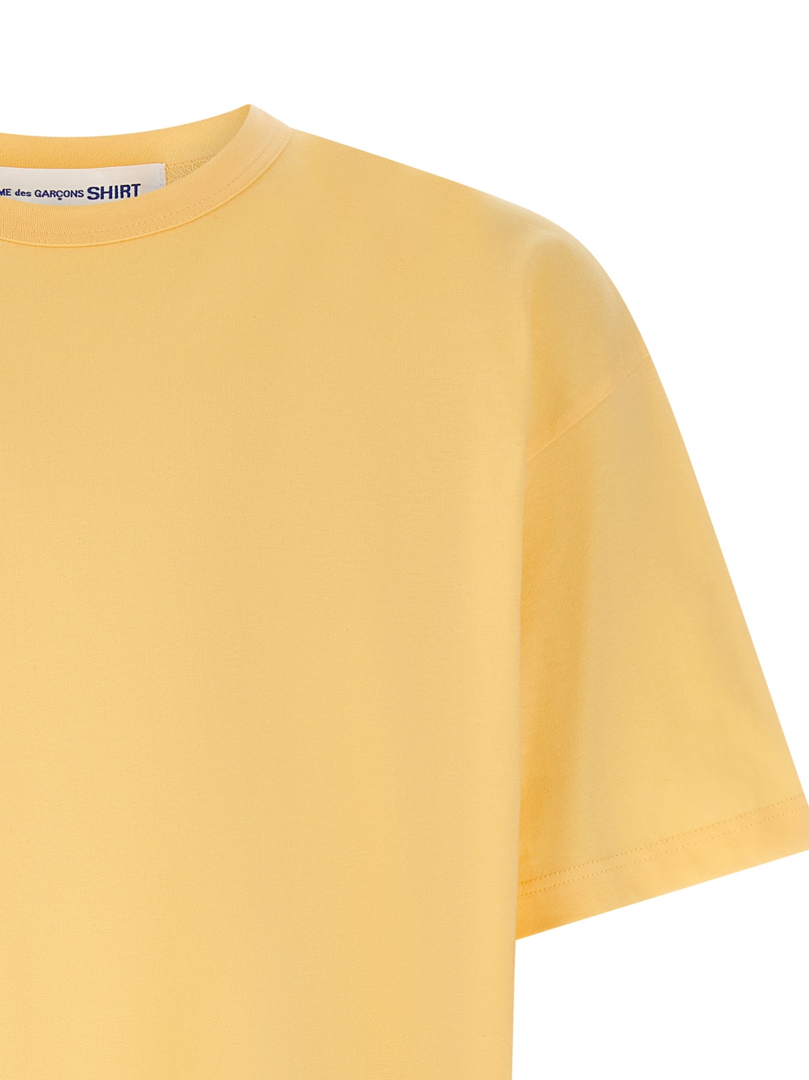 T-Shirt by Comme Des Garçons for men in cotton orange & print features an edgy silhouette, meticulously detailed with a sophisticated and crew neckline for a truly edgy finish.
