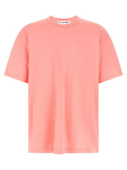 T-Shirt by Comme Des Garçons for men in cotton multicolor, pink & print showcases a unassuming silhouette, artfully detailed with a refined crew neckline and unassuming for a sophisticated, contemporary look.
