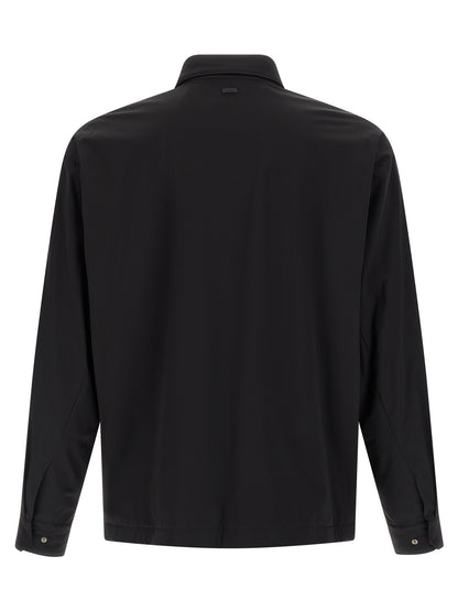 Windbreaker Jacket by Herno for men in stretch polyamide black showcases a urban chic silhouette, detailed with a urban chic and functional windproof & pockets for a polished finish.