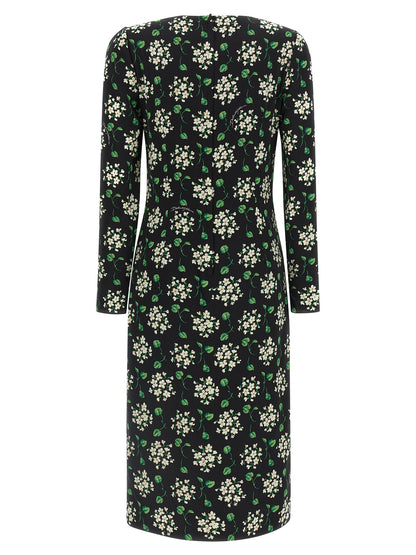 Dress by Dolce & Gabbana for women in synthetic silk black & print showcases a striking silhouette, elegantly detailed with a , refined crew split neckline, and a striking midi for a striking finish.