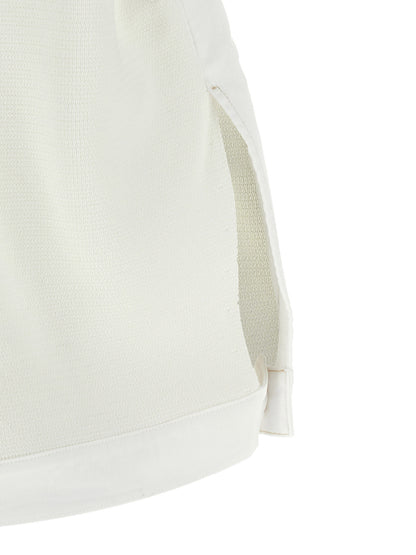 Vest by Fabiana Filippi for women in stretch denim cotton gold & white showcases a utilitarian silhouette, artfully incorporating pockets and a utilitarian crew neckline for a truly utilitarian finish.