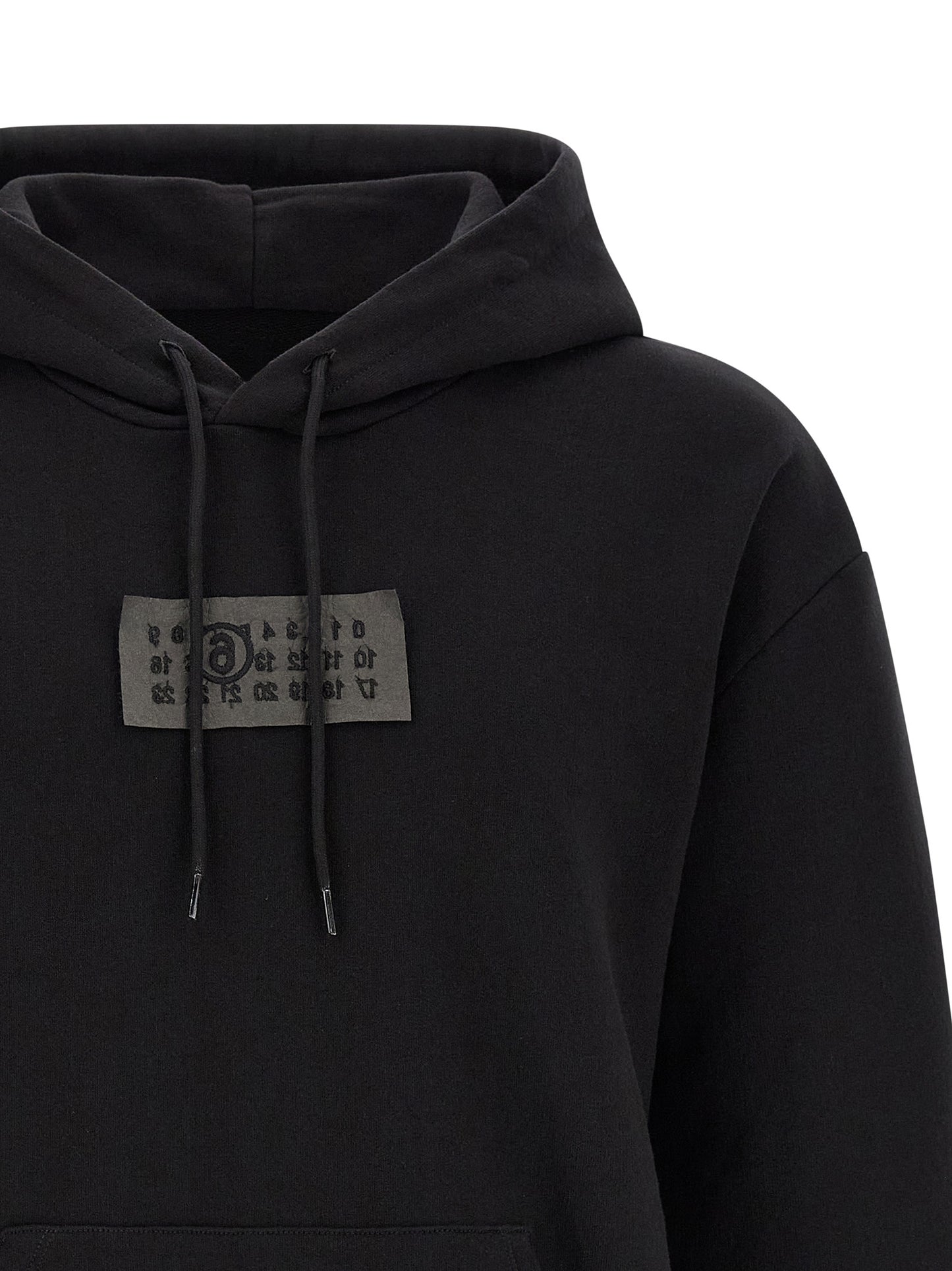 Sweatshirt Hoodie by MM6 Maison Margiela for men in cotton black features an luminous silhouette, showcasing a sophisticated hooded neckline and for a truly luminous look.