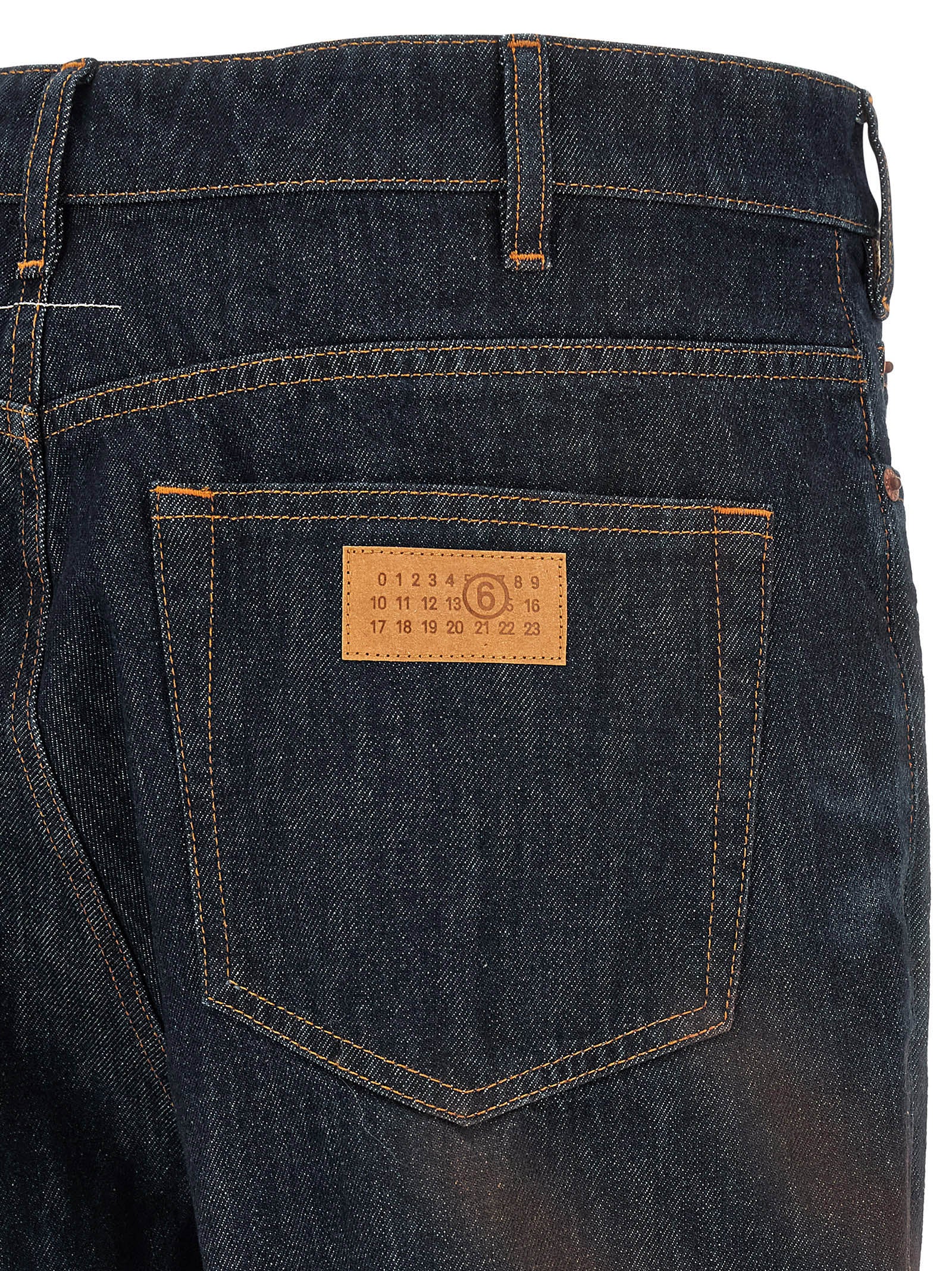 Jeans by MM6 Maison Margiela for men in cotton denim blue features an refined tailoring silhouette, showcasing a premium straight-leg with a high rise and long cut for a refined tailoring look.