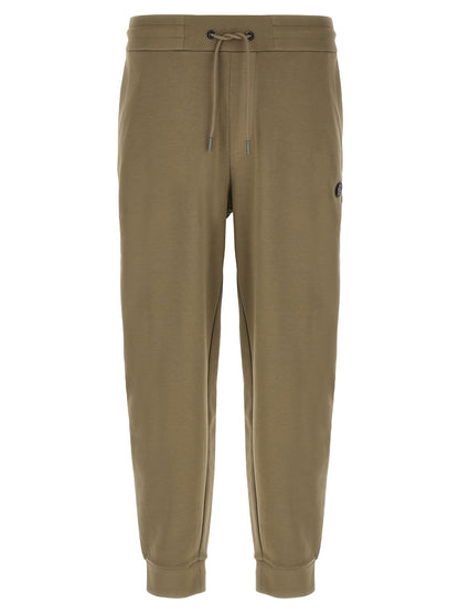 Joggers by Hugo Boss for men in polyester cotton & leather bicolour & green presents a tailored silhouette, showcasing a tailored straight-leg and long cut with a refined for a truly tailored aesthetic.