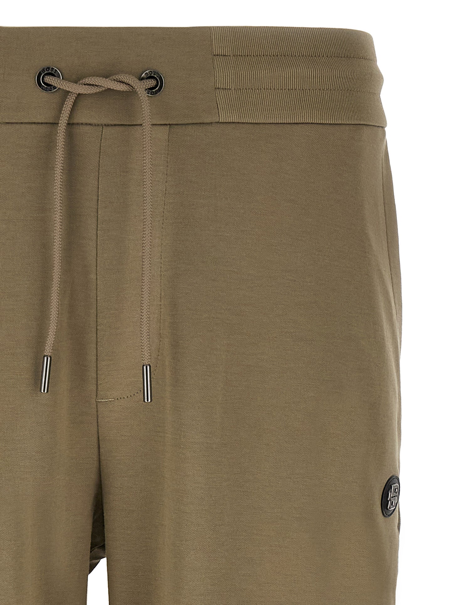 Joggers by Hugo Boss for men in polyester cotton & leather bicolour & green features an refined tailoring silhouette, showcasing a premium straight-leg with a and long cut for a refined tailoring look.